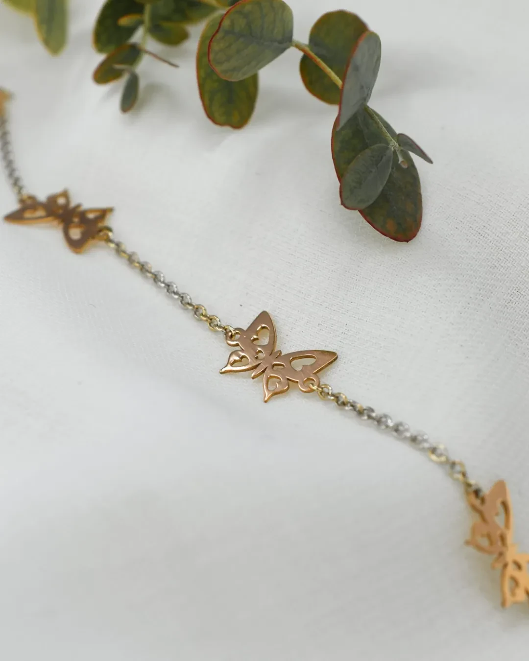 Braccialetto farfalle in oro bianco e rosa