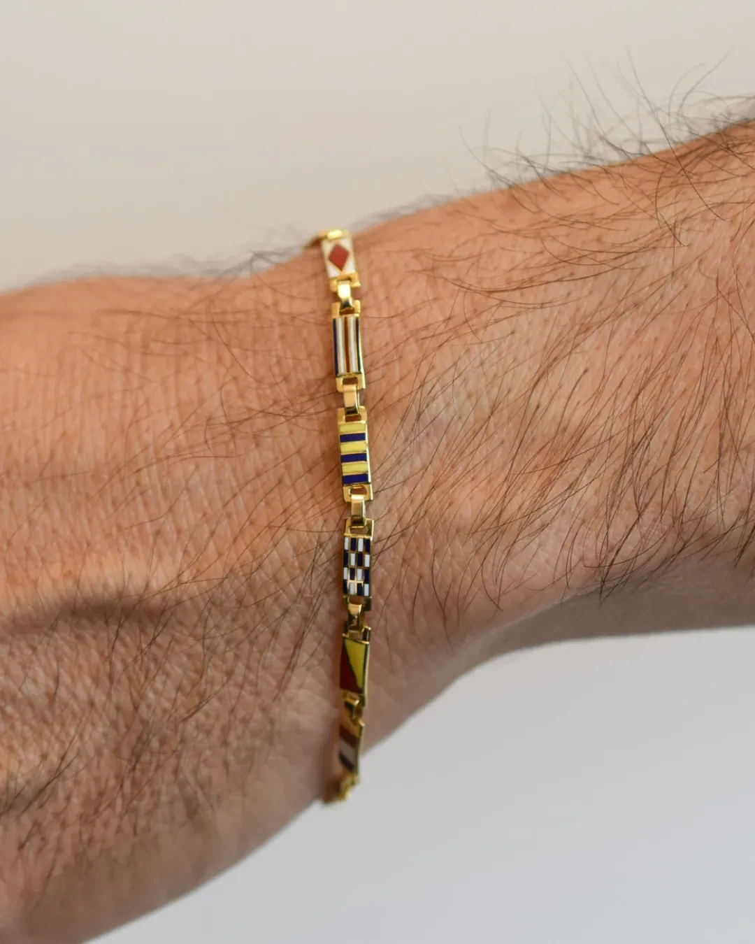 Bracciale uomo bandierine oro giallo