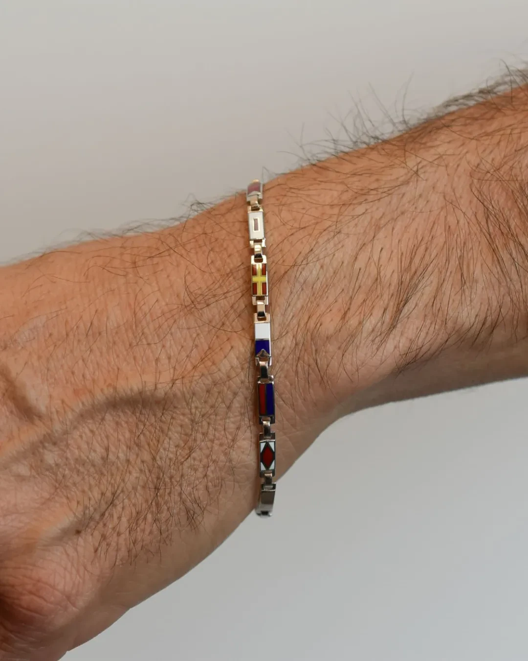 Bracciale uomo bandierine oro bianco